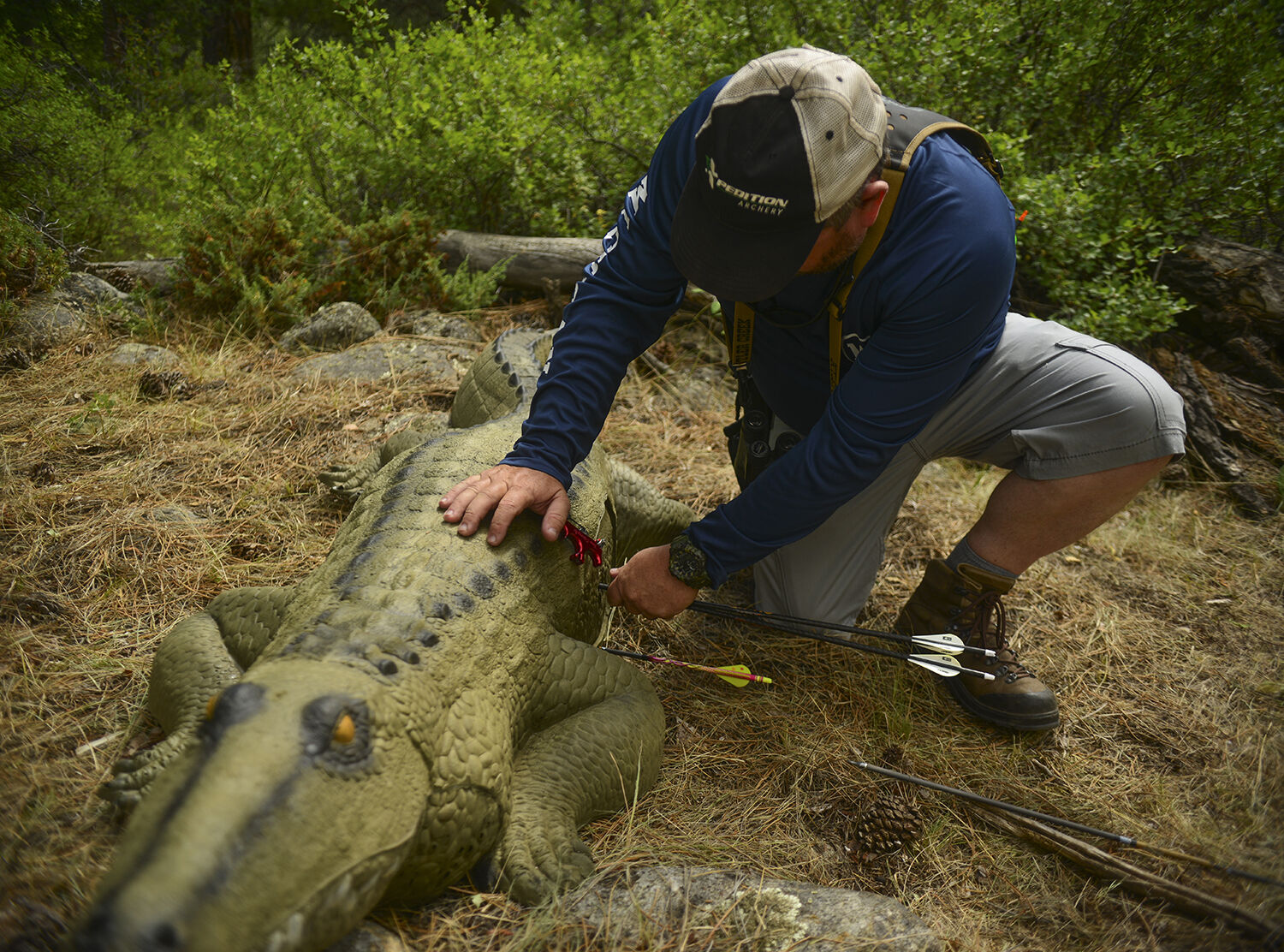 Chris Smith removes his two and his wife two arrow from the alligator target